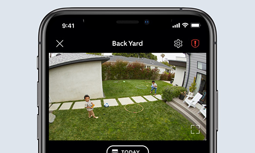 phone display of two kids in back yard