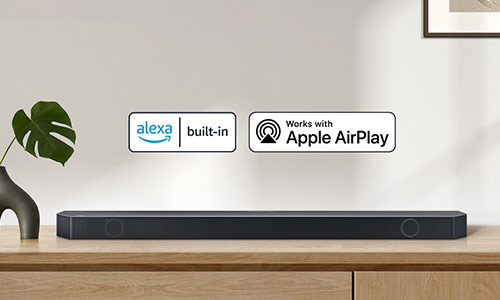 Chromecast built-in logo and Works with Alexa, Hey Google, and Apple AirPlay logos with a Samsung Q series Soundbar.