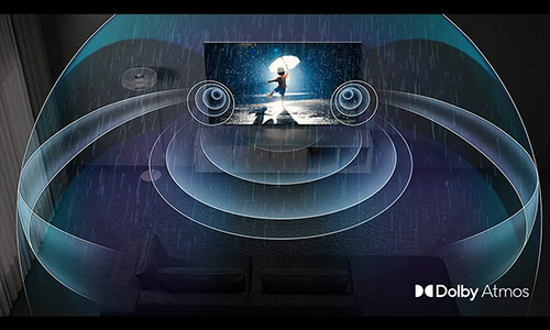A QLED TV is showing a child playing in the rain. Surround sound emitted from Dolby Atmos is filling the room.