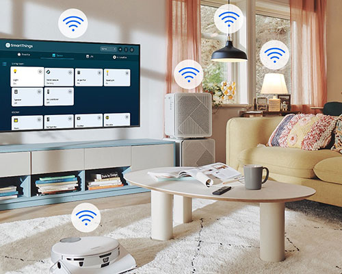 The SmartThings UI is on display on the TV. Wi-Fi icons are floating on top of the TV, vacuum robot, air purifie and lights