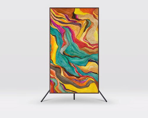 The Frame is on an Auto Rotating Stand showcasing an artwork and is rotated vertically.
