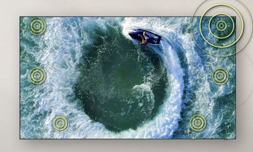 A person on a boat is making circular motion on the water. Built-in speakers follow the sound of the boat as it moves.