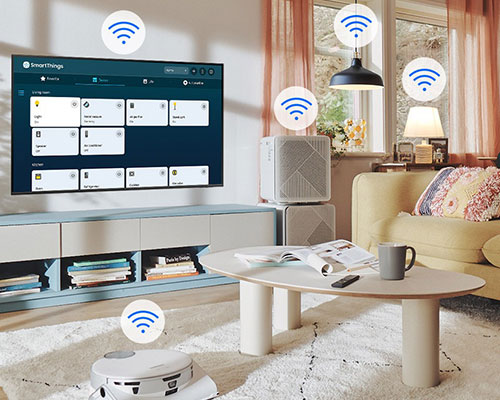 The SmartThings UI is on display on the TV. Wi-Fi icons are floating on top of the TV, vacuum robot, air purifie and lights